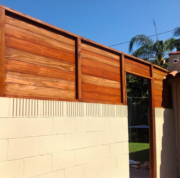 tall privacy fencing from cinder block and wood