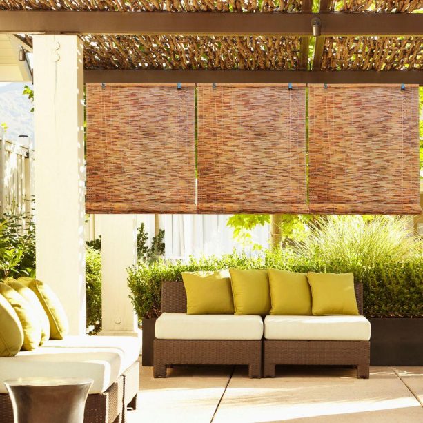 natural-patterned roll up bamboo shades in a patio