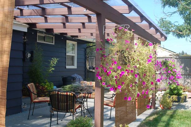 patio roll up bamboo blinds paired with hanging flowery plants