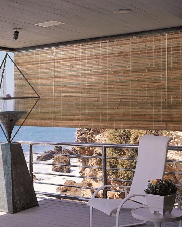 the use of roll-up bamboo blind in a beach house balcony