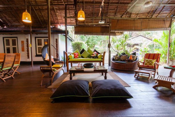 tropical porch with roll-up bamboo blinds to protect furniture from sun fade