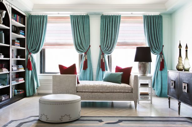 turquoise drapes with red tasseled-tiebacks