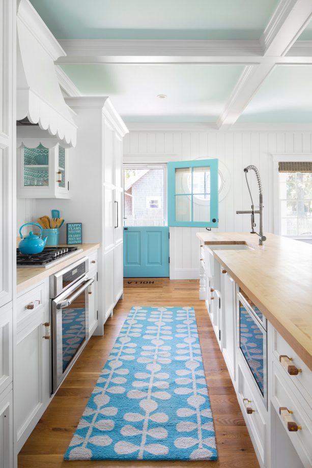 white, turquoise, and light brown color scheme in a beach-style kitchen