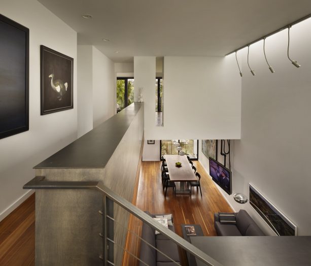 a half wall as a safety rail in a modern hall