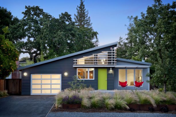 a midcentury exterior home design with dark grey color and white trim