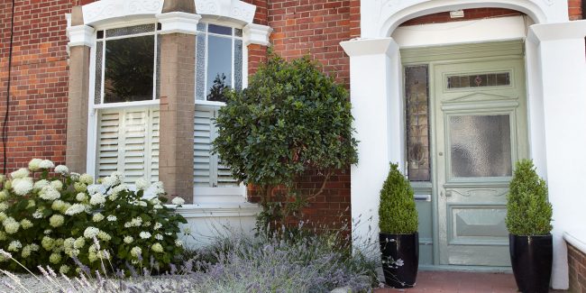 Café style shutters fitted onto a sash window - exterior image