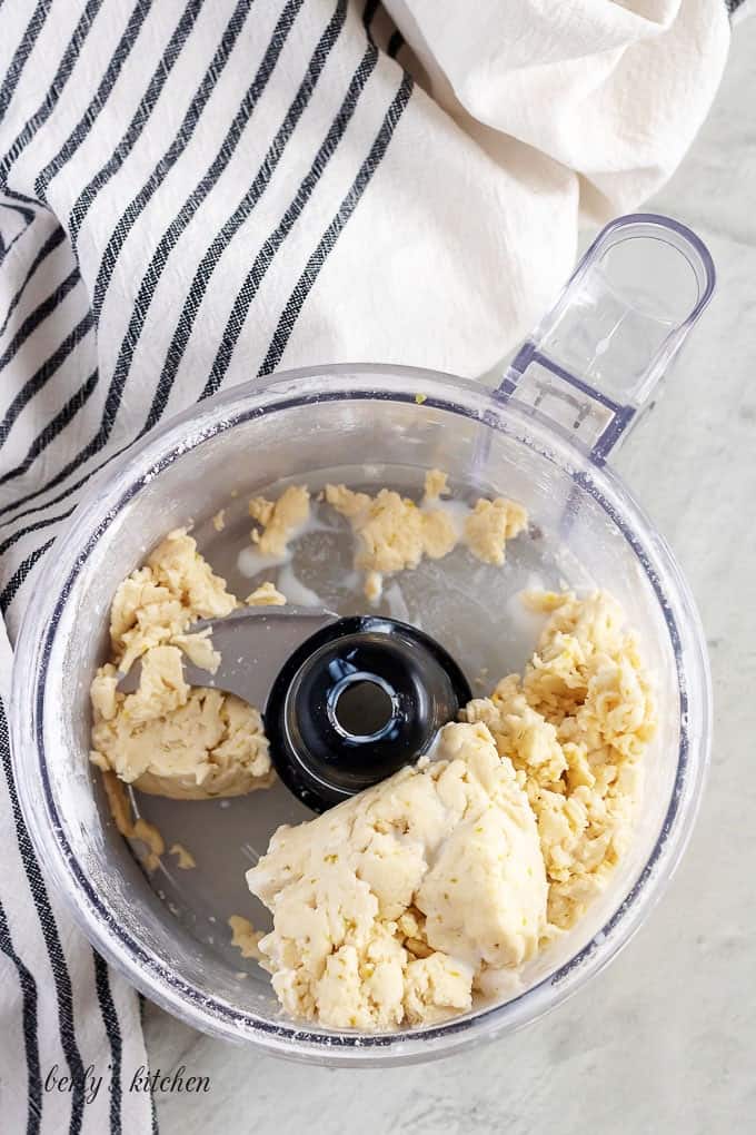The wet ingredients have been added, creating a sticky biscuit dough.