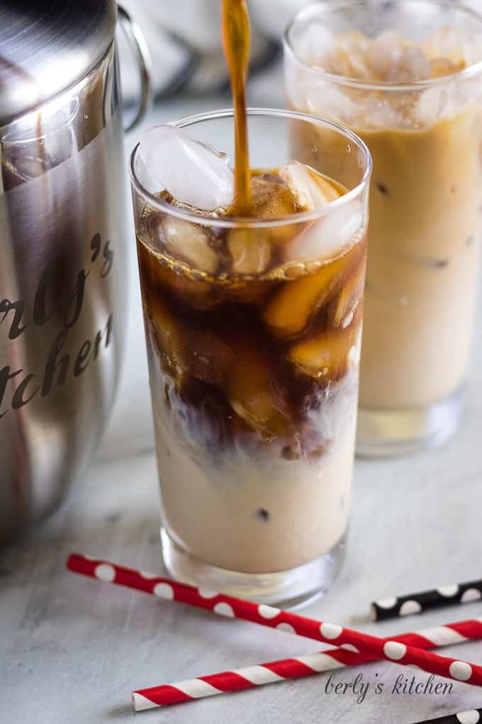 The coffee is being added to the ice and Irish cream.
