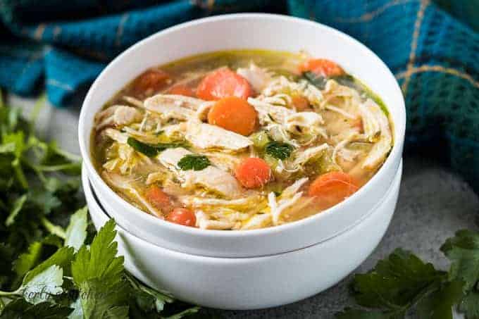 A bowl of the homemade chicken soup showing the ingredients.