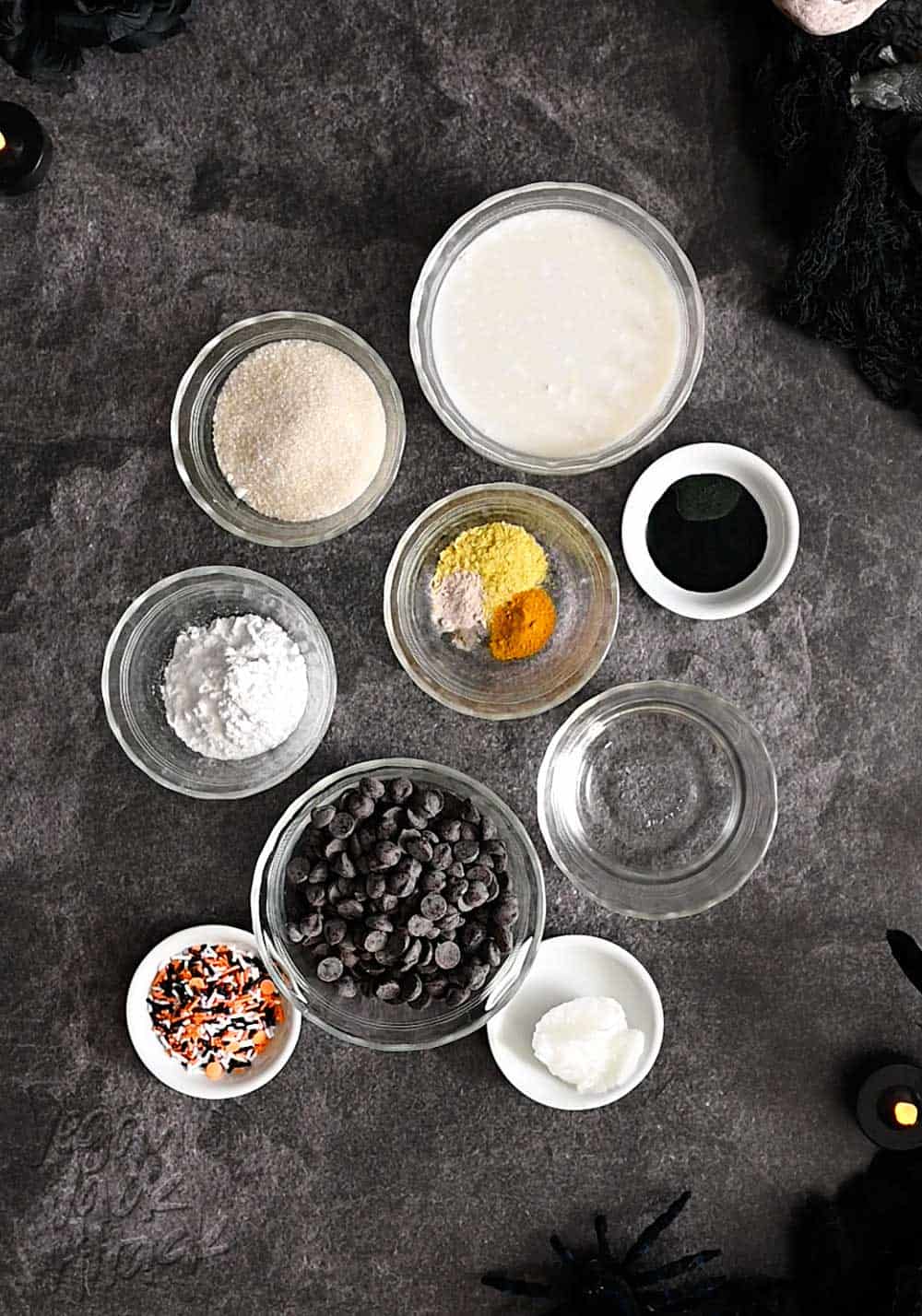 Ingredients for truffles in ramekins on black marble