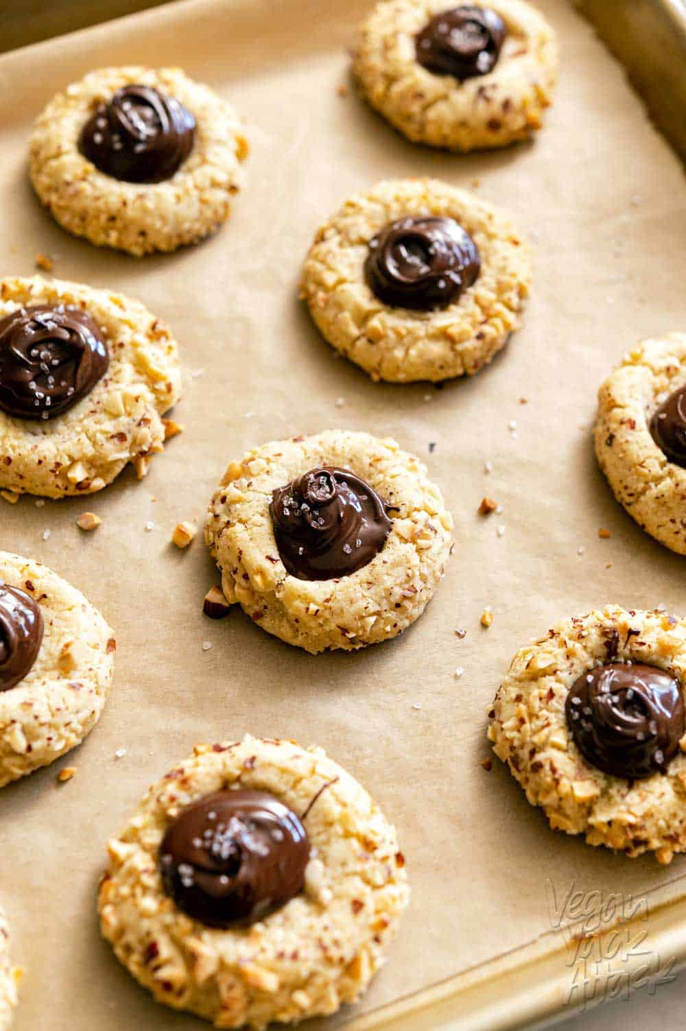 Close up shot of thumbprint cookies filled with chocolate