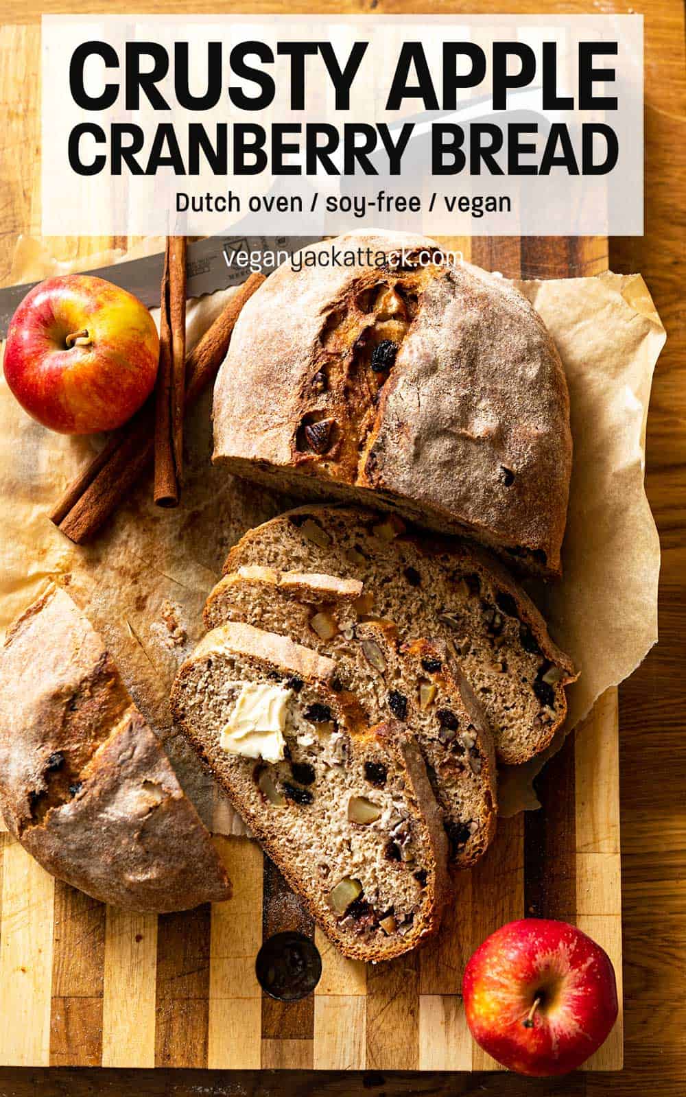 Loaf of whole wheat bread partially cut into slices on cutting board with reading text "Crispy Dutch Bread with Apple and Cranberries"