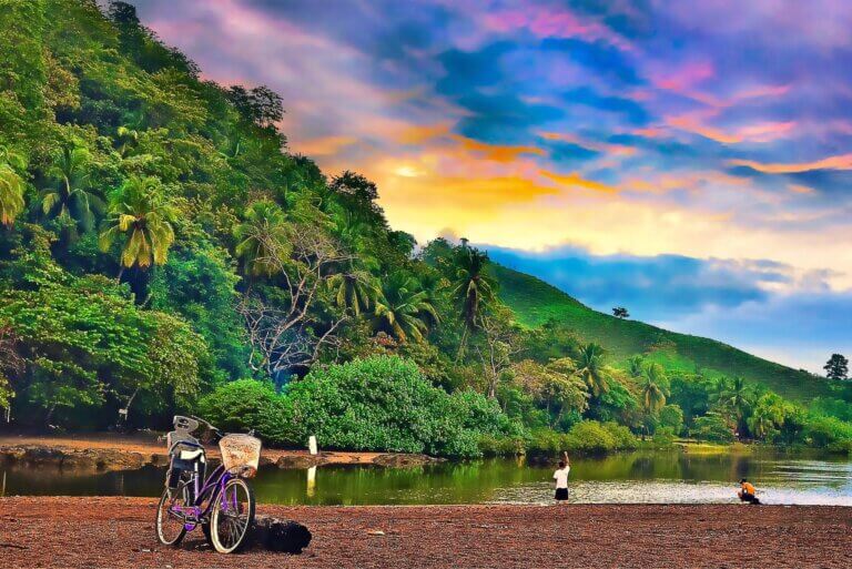 Bicycle parked alongside the water