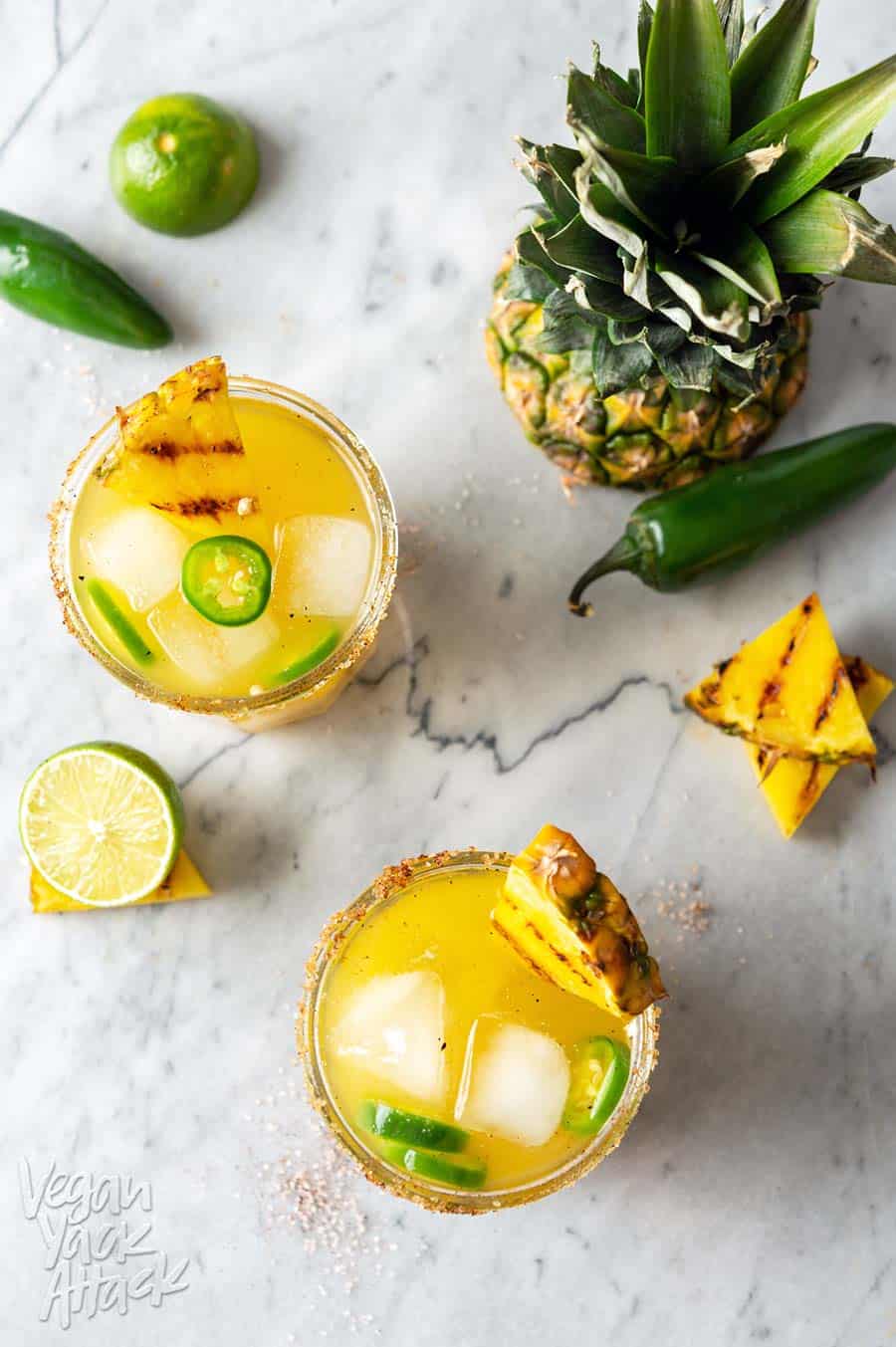 These Charred Pineapple Jalapeño Margaritas are better than any of their predecessors and unique in their own way! Try out this recipe to cool down, while also bringing the heat. #cocktails #margaritas #pineapple #recipe #jalapeno