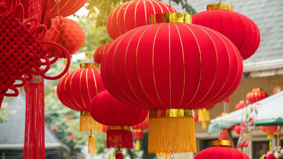 Decorative red lanterns hang around buildings for the Chinese New Year.