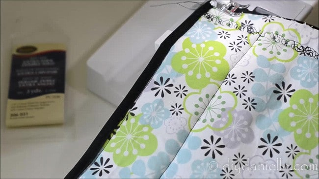 Sew on bias tape to your hot pad.