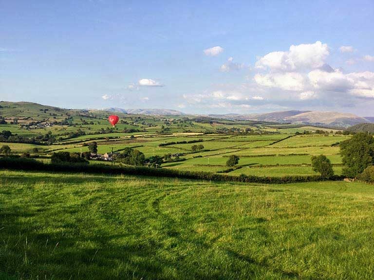 A Virgin Balloon drifts over Kelker Well Roundhouse near the Lake District