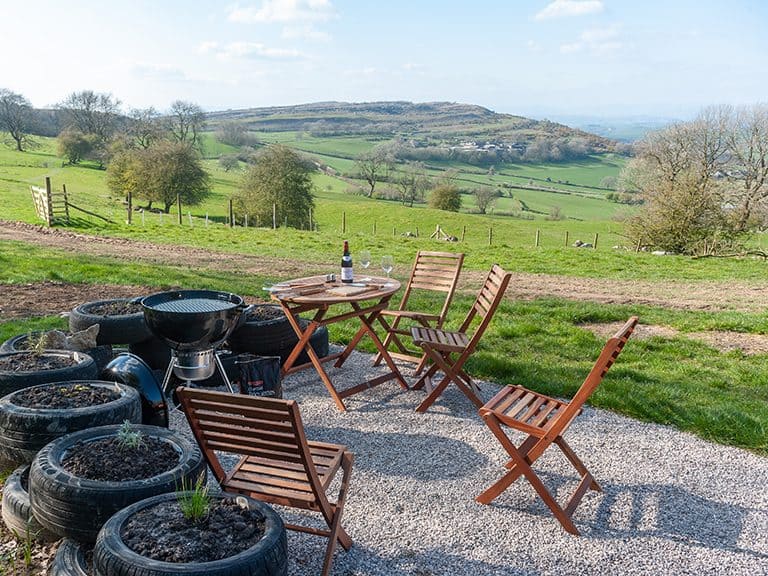 The outdoor dining experience at Kelker Well Roundhouse comes with stunning views of the surrounding areas of outstanding natural beauty