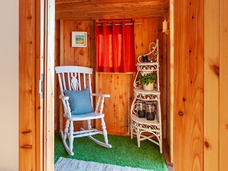 The rocking chair in the porch of Kelker Well Roundhouse, a stunning & sustainable example of farm diversification