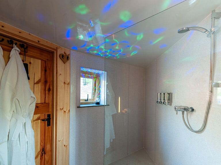 The shower & door out to the hot tub of the roundhouse located on Whin Yeats farm in Cumbria
