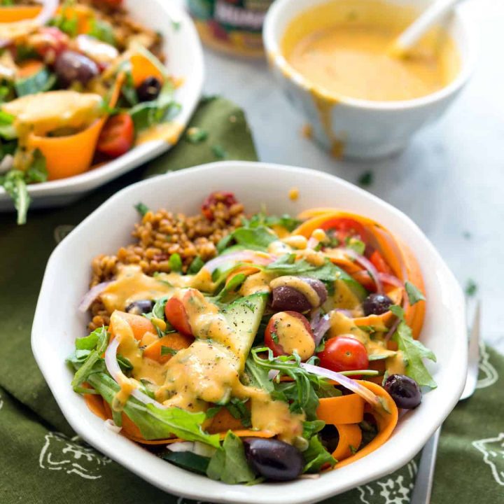Arugula Bulgur Pilaf Salad - A tangy mix of warm, quick pilaf with a crunchy refreshing salad, and red pepper dressing. Perfect for Spring! #vegan #WildGarden #soyfree