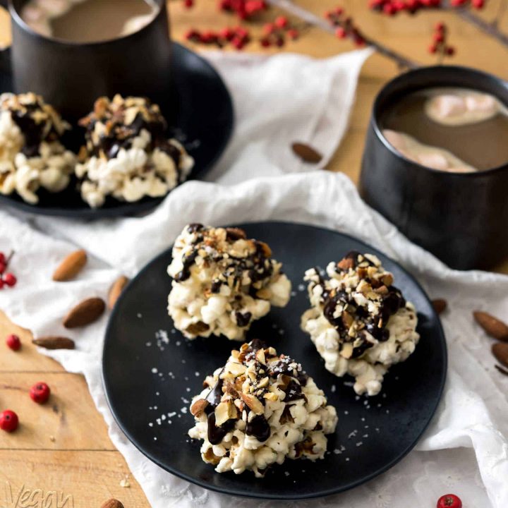 Rocky Road Popcorn Clusters are a wonderfully easy treat to make for holiday festivities, or as gifts for the sweet lovers in your life! Chewy, chocolate-covered, with toasted almonds and salt, what’s not to love? #vegan #glutenfree
