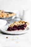 Introducing our favorite summer pie: Cherry Crumb Pie. A flaky pie crust filled with fresh cherries, and topped with crumble. The perfect cherry pie recipe!
