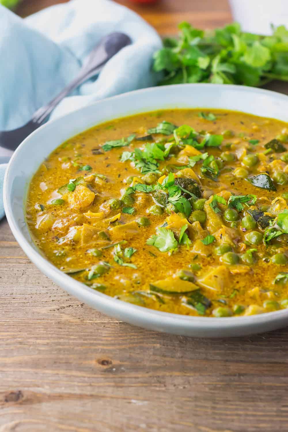 Zucchini and Peas Curry in a bowl
