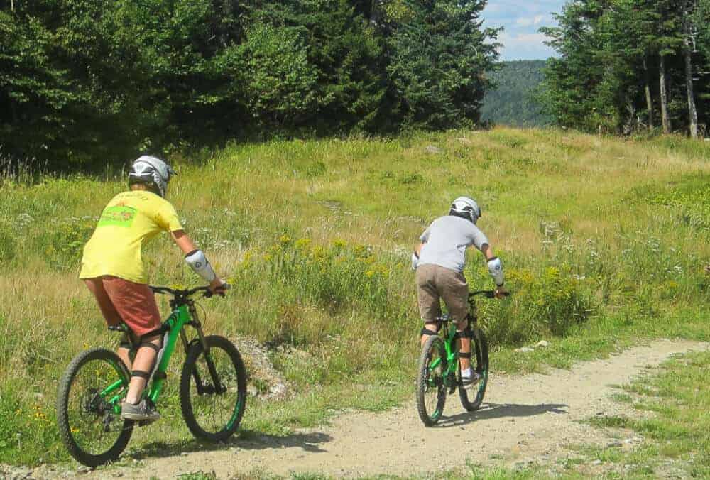 Mount Snow Mountain Biking Two boys ride the mountain biking trails at Mount Snow in Vermont.