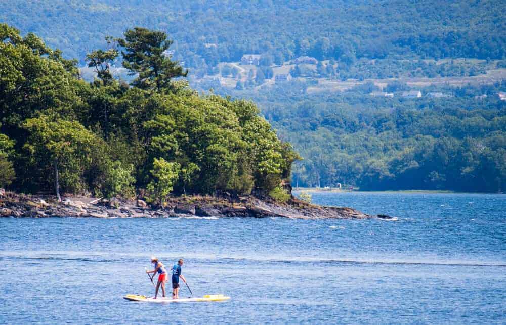 Burton Island State Park Two people paddle board of the shore of Burton Island State Park in the Lake Champlain Islands.