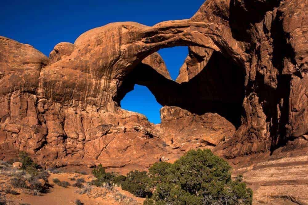 best road trips in the United States A view of some of the many arches at Arches National Park in the Winter.