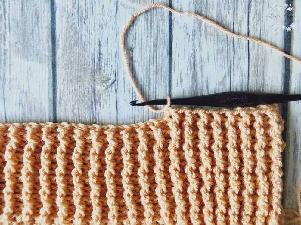 picture of crochet blanket in orange border