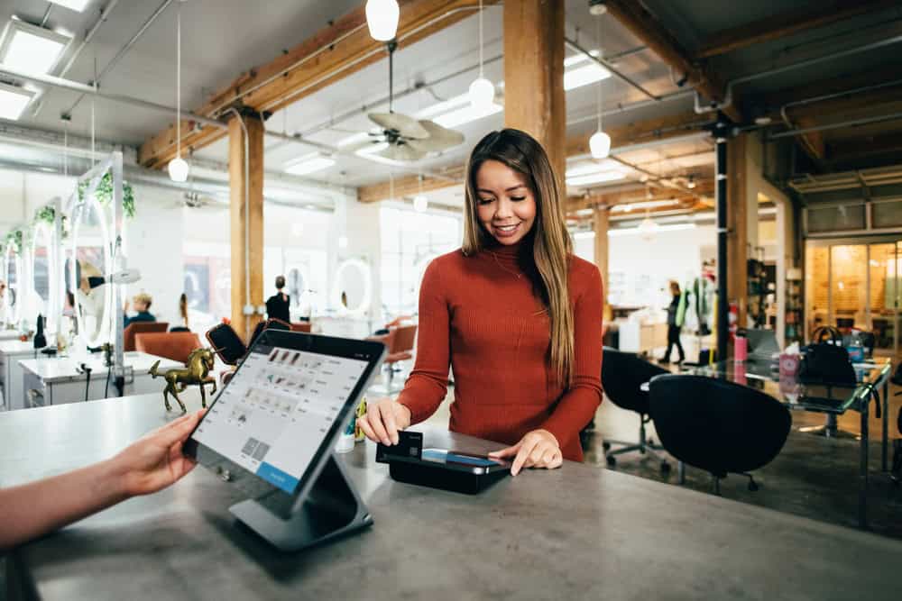 ipad in retail environment aided by the OnSpot Social App