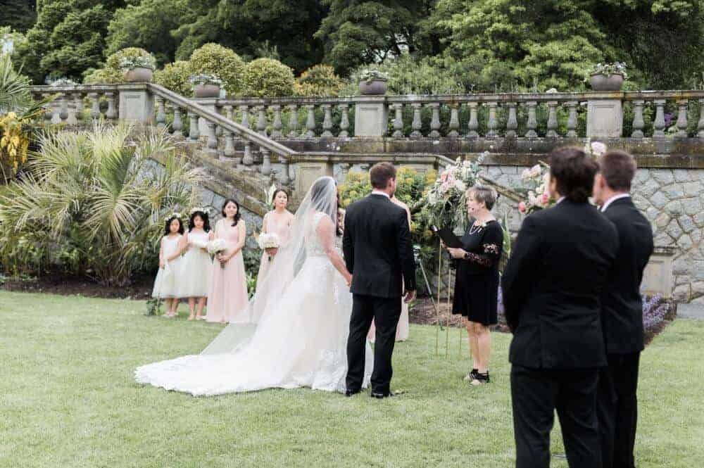 Image of wedding - bride and groom with pastor