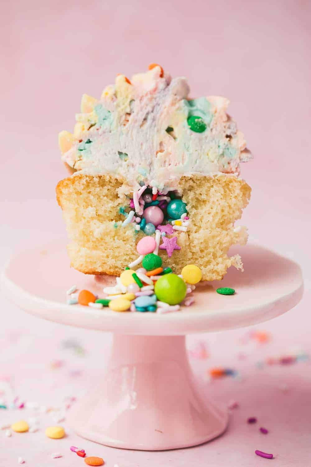 Pinata Cupcakes With Rainbow Icing