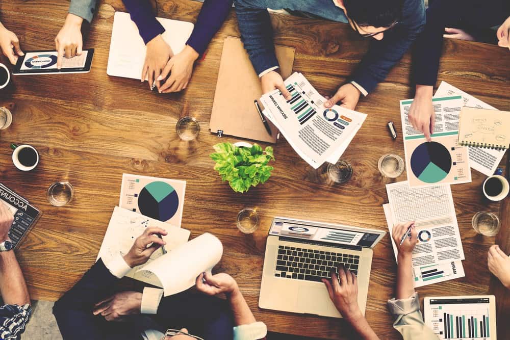 Group of marketing experts discuss facts and figures.