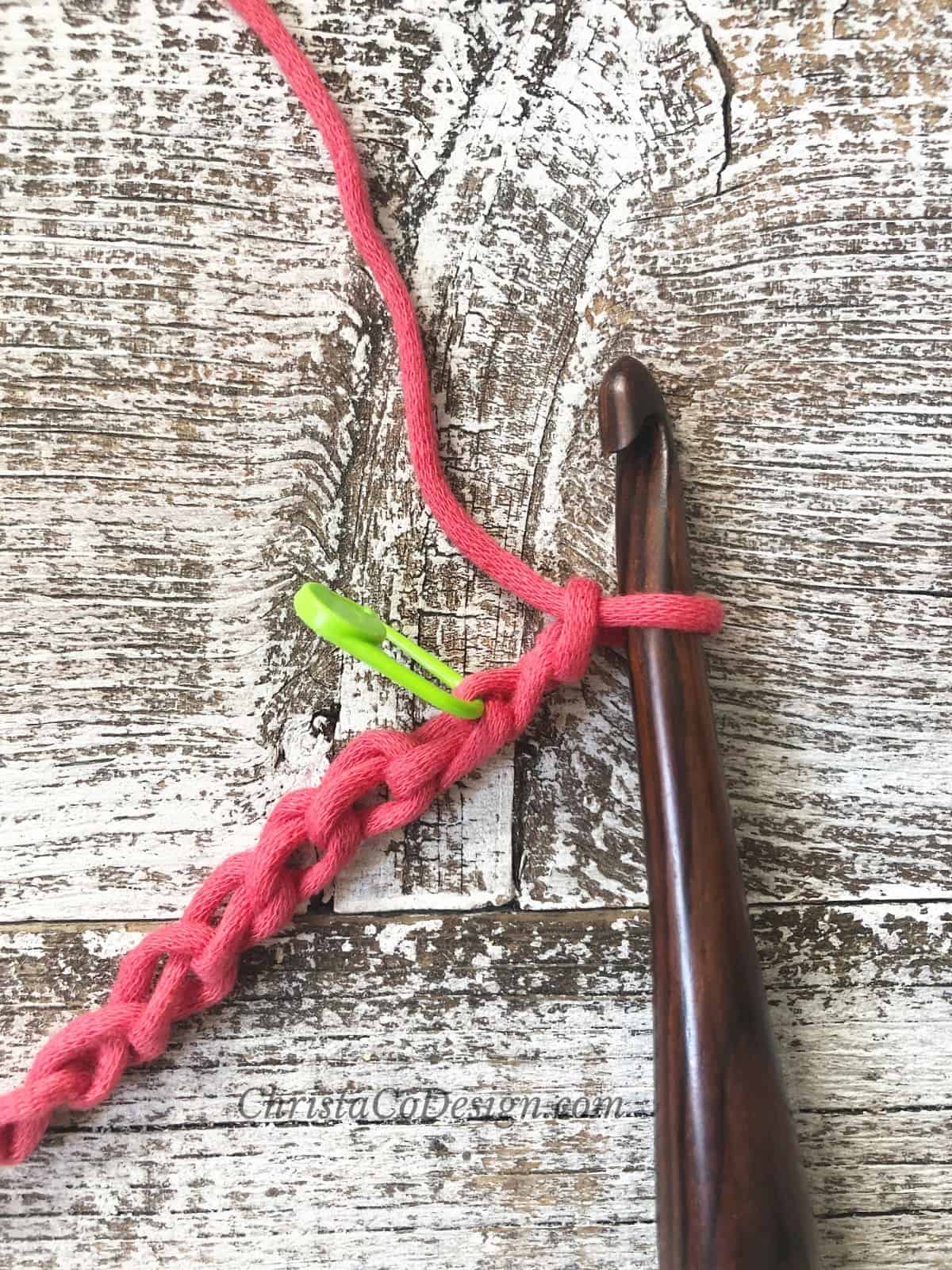 picture of green stitch marker in chain lemon peel stitch tutorial