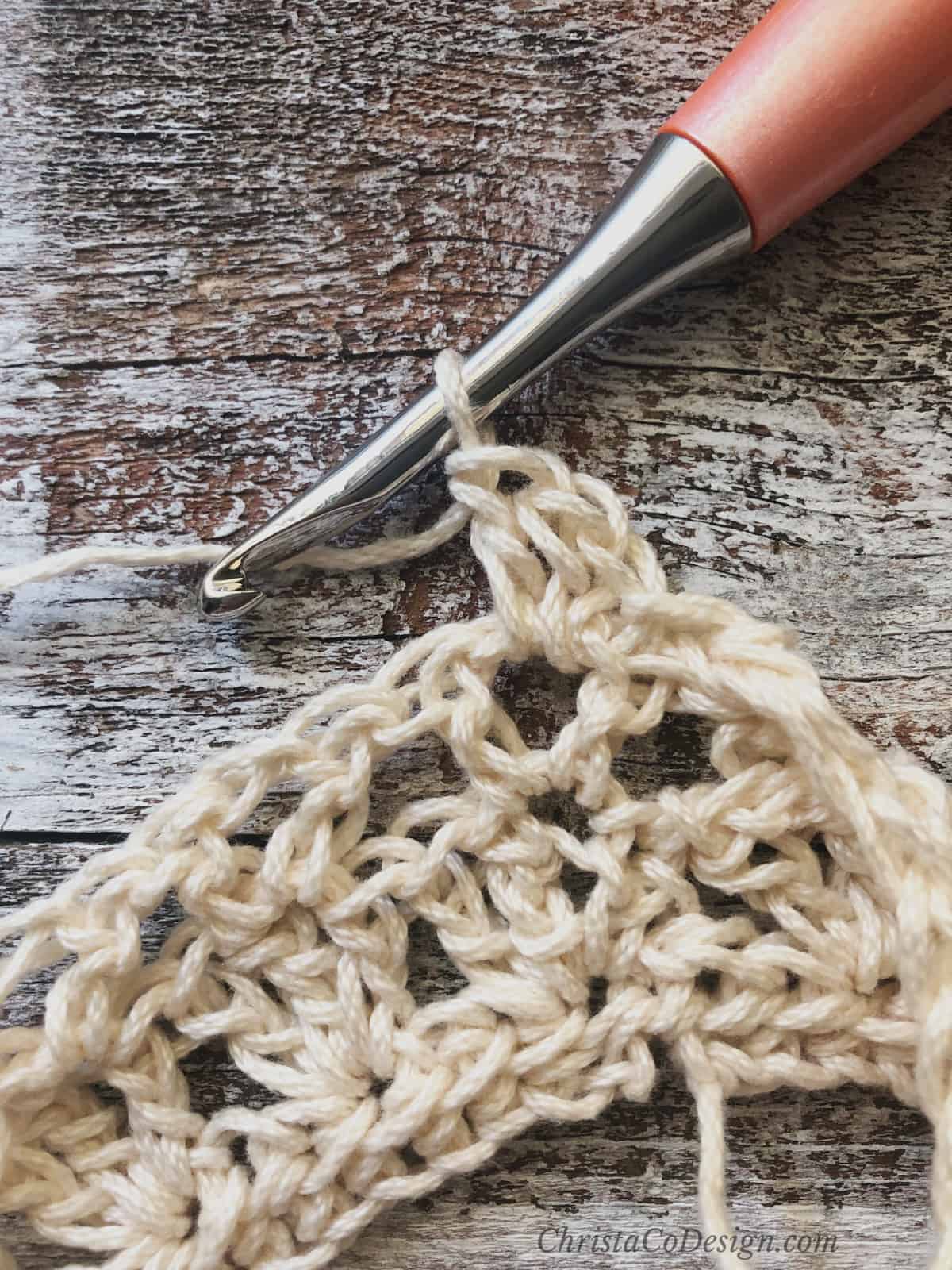 picture of row 4 dc crochet headband tutorial in cream