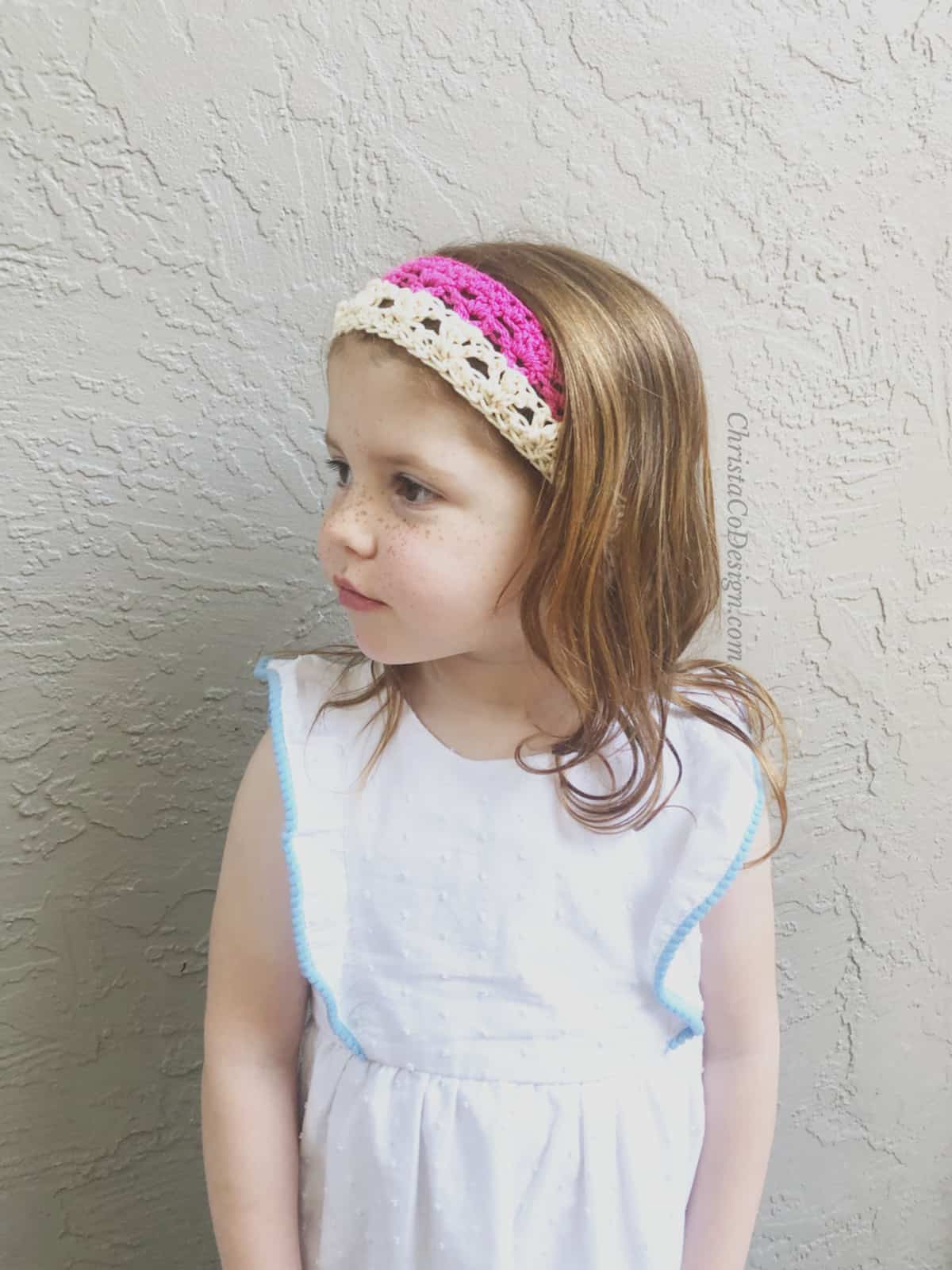 picture of girl in white with pink crochet headband