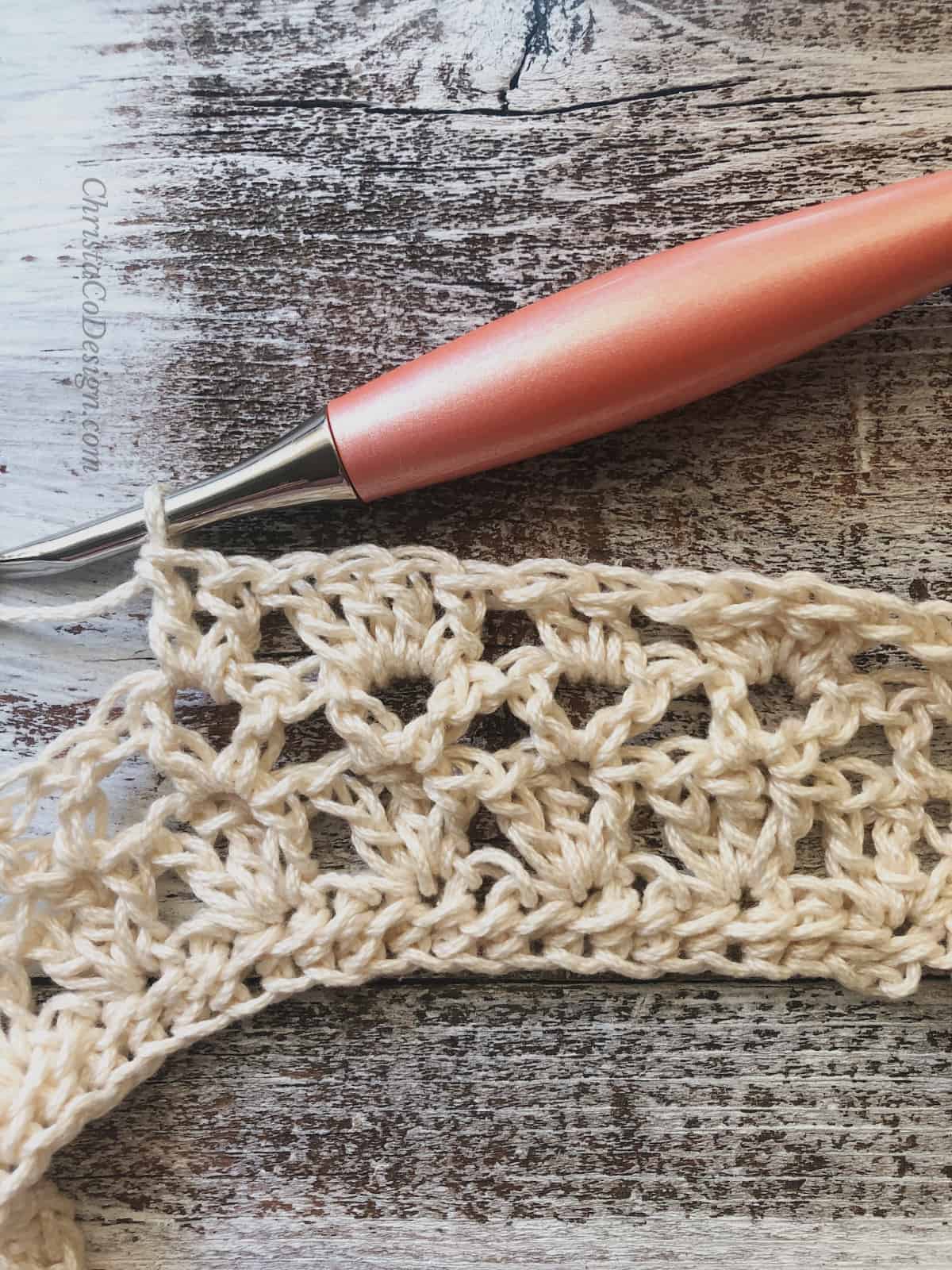 picture of row 4 alternating repeats cream yarn peach crochet hook