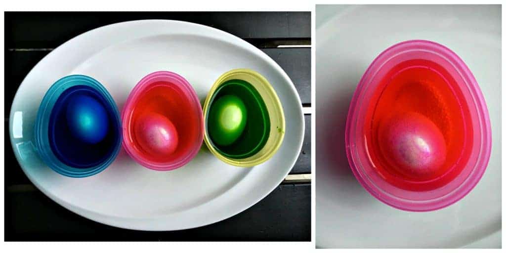 Eggs sitting is cups of dye.
