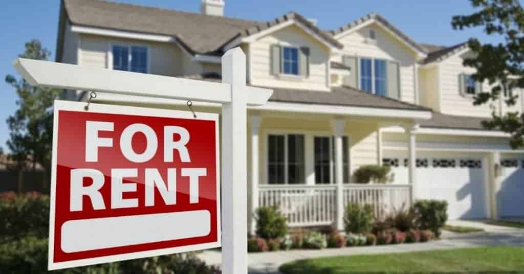 Image of a nice house with a for rent sign out front - how I bought my first rental property