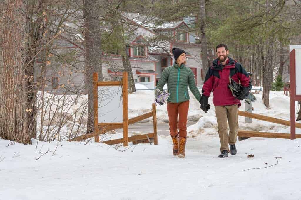snowshoeing couple on a trail snowshoeing couple on a trail
