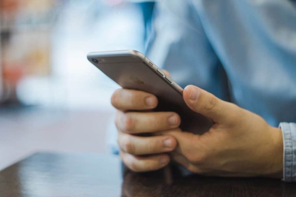 Business man on his mobile | Using Social Media For Customer Service | Kanuka Digital