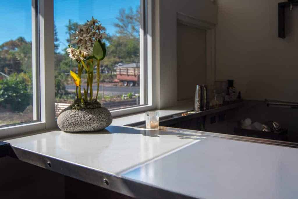 White concrete wine bar with steel edge detail