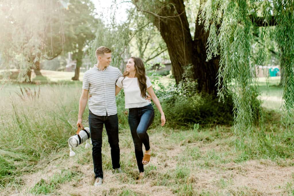 chicago engagement session couple walking on the grass