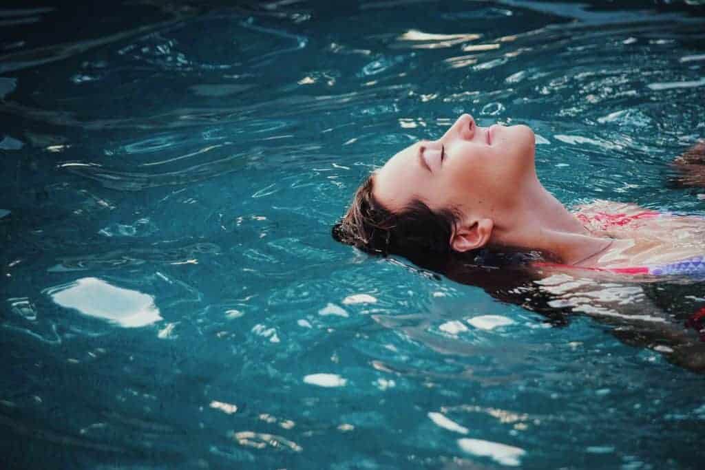 woman relaxed floating on the water