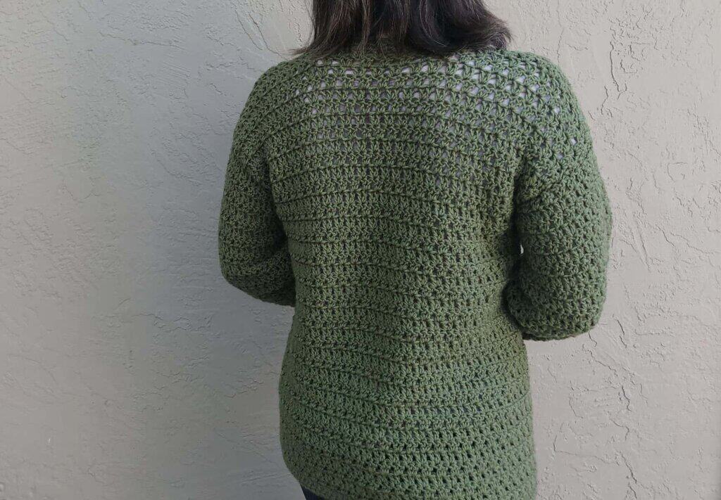 Picture of woman in green cardigan crochet back