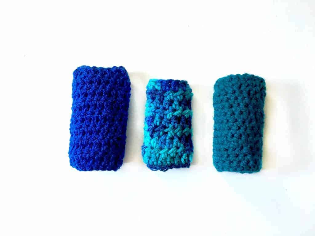 three finished ice pop cozies laid out on a white table