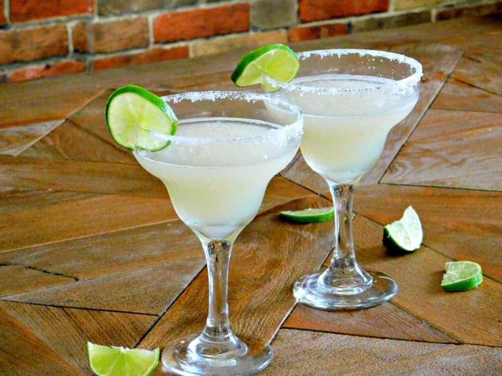 Lime Margaritas with lime on table